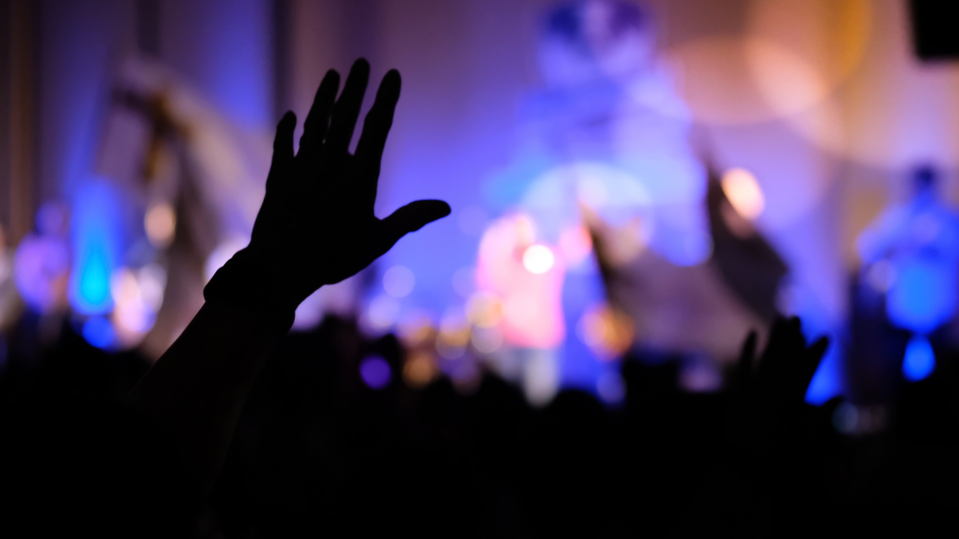 Hands raising concert, hands raising for religion background